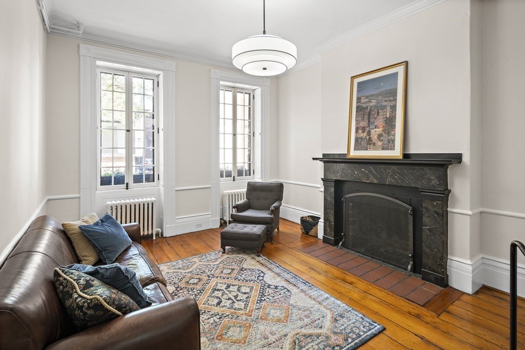 a living room with furniture and a fireplace