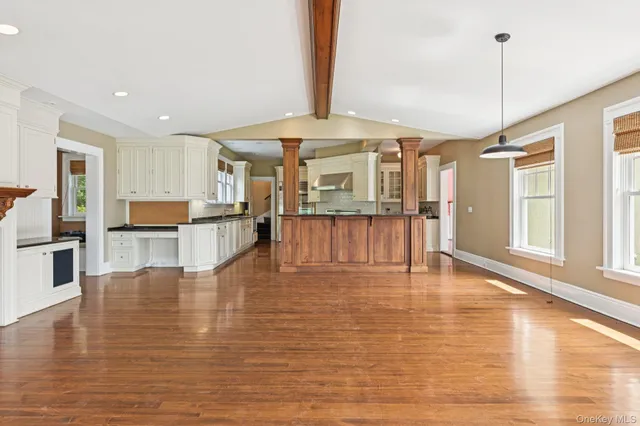 a view of kitchen with furniture and wooden floor