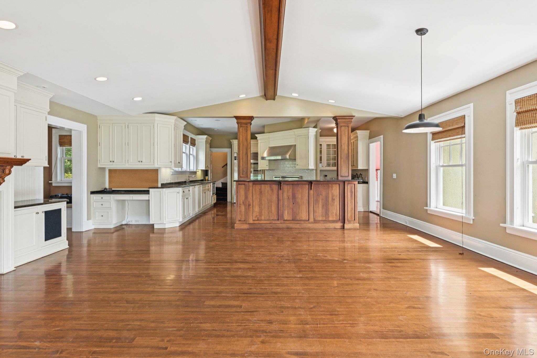 90 Thompson Avenue Babylon, NY 11702 - Photo 12 of 35 Kitchen featuring decorative light fixtures, dark countertops, backsplash, dark wood-style floors, and recessed lighting