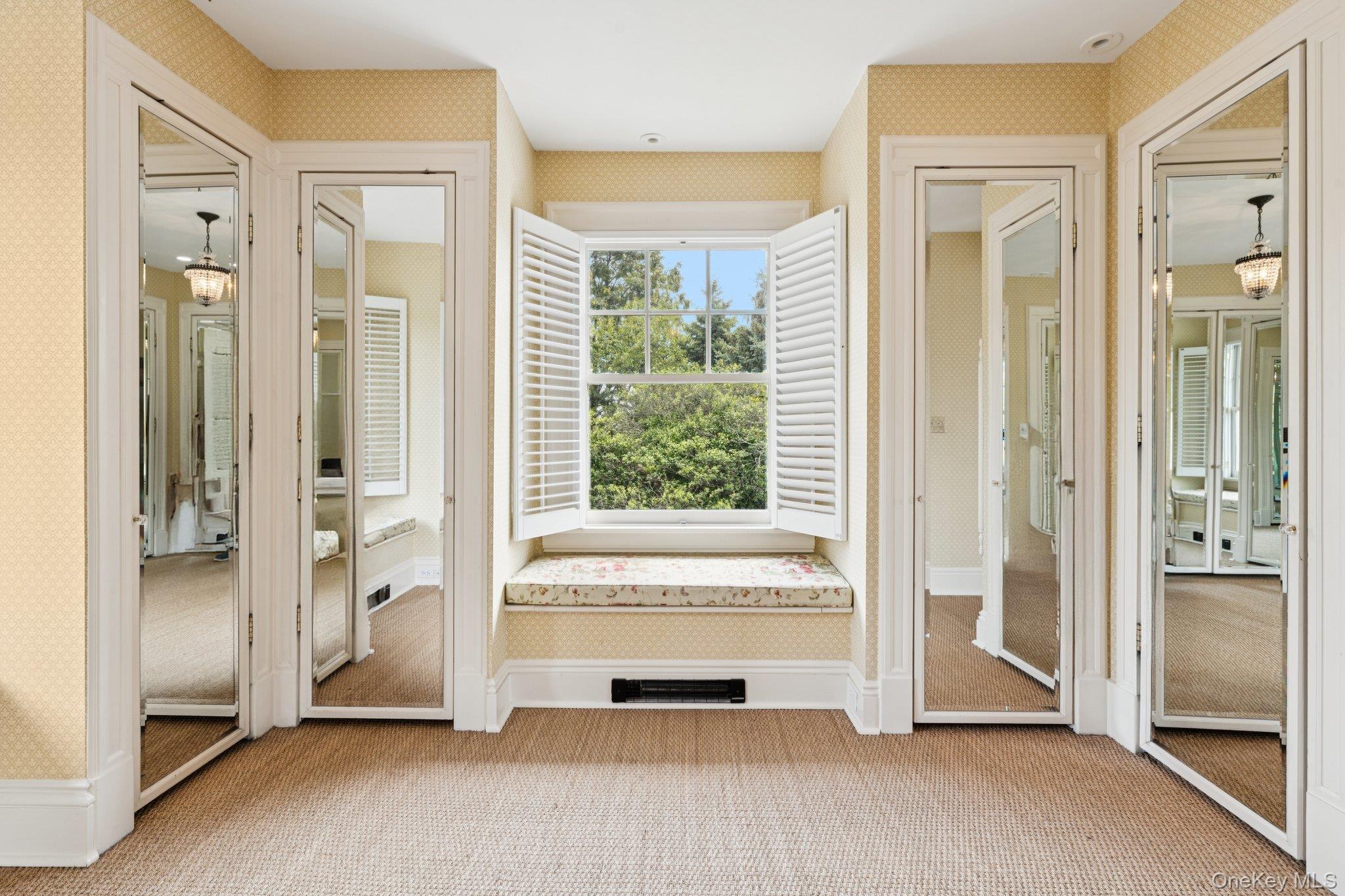 90 Thompson Avenue Babylon, NY 11702 - Photo 18 of 35 Entryway featuring wallpapered walls and carpet flooring