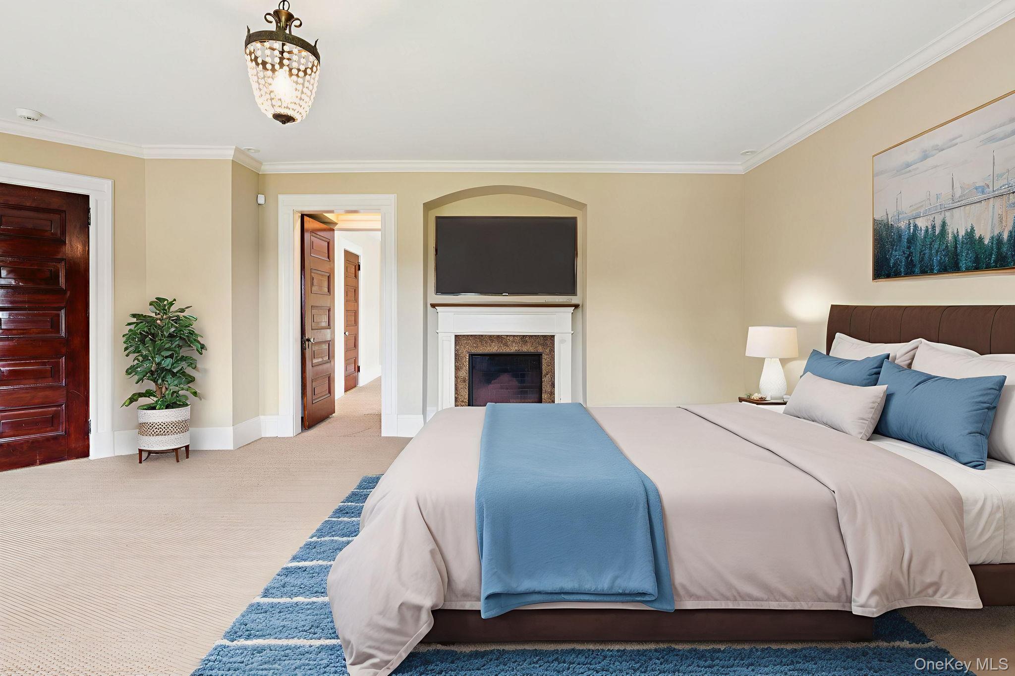 90 Thompson Avenue Babylon, NY 11702 - Photo 21 of 35 Bedroom with crown molding, carpet, and a glass covered fireplace