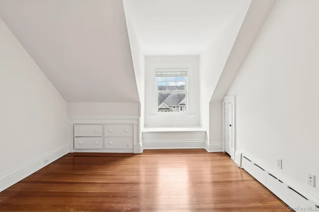 a view of a room with wooden floor and balcony