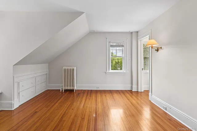 a view of a balcony with wooden floor