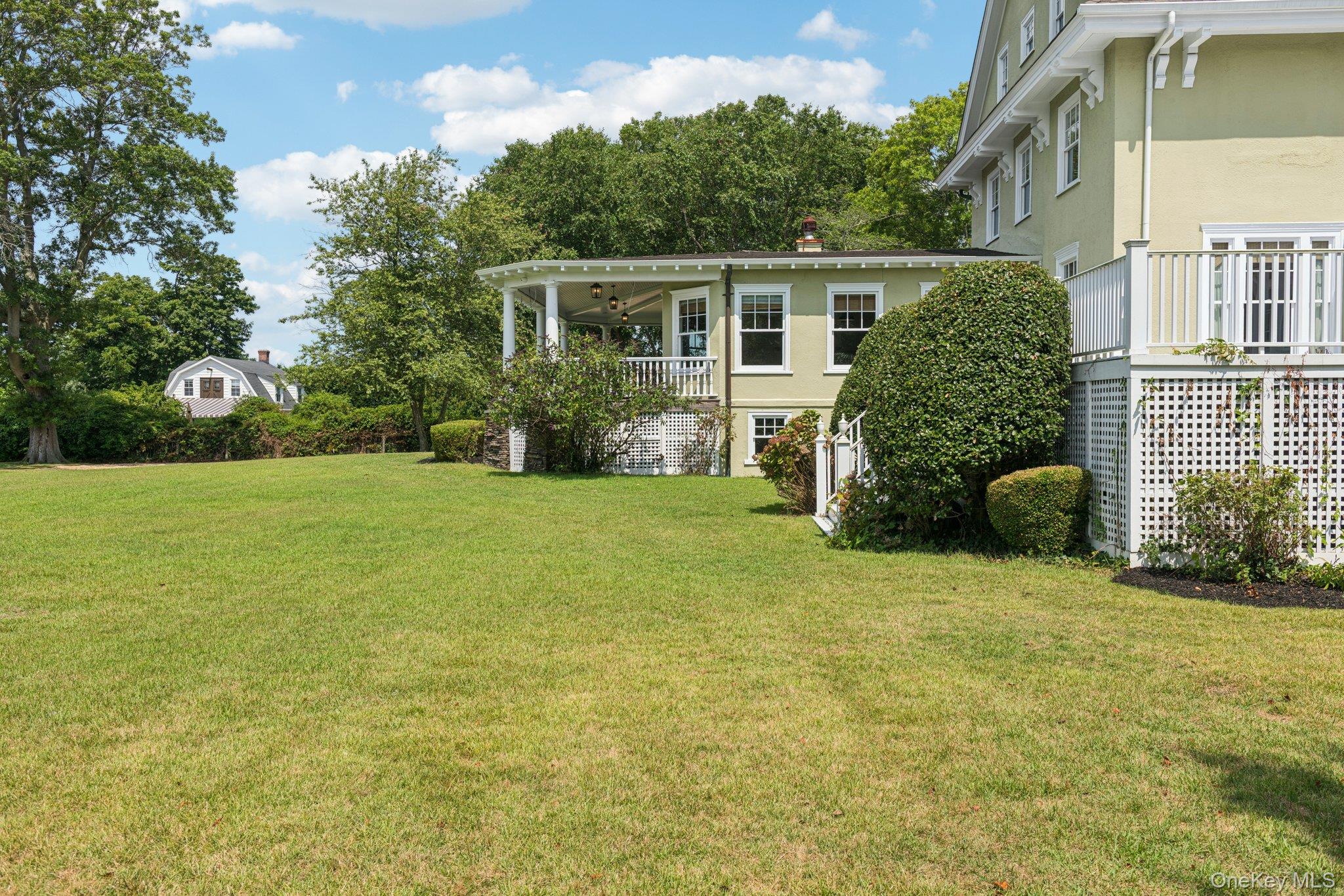 90 Thompson Avenue Babylon, NY 11702 - Photo 33 of 35 View of grassy yard