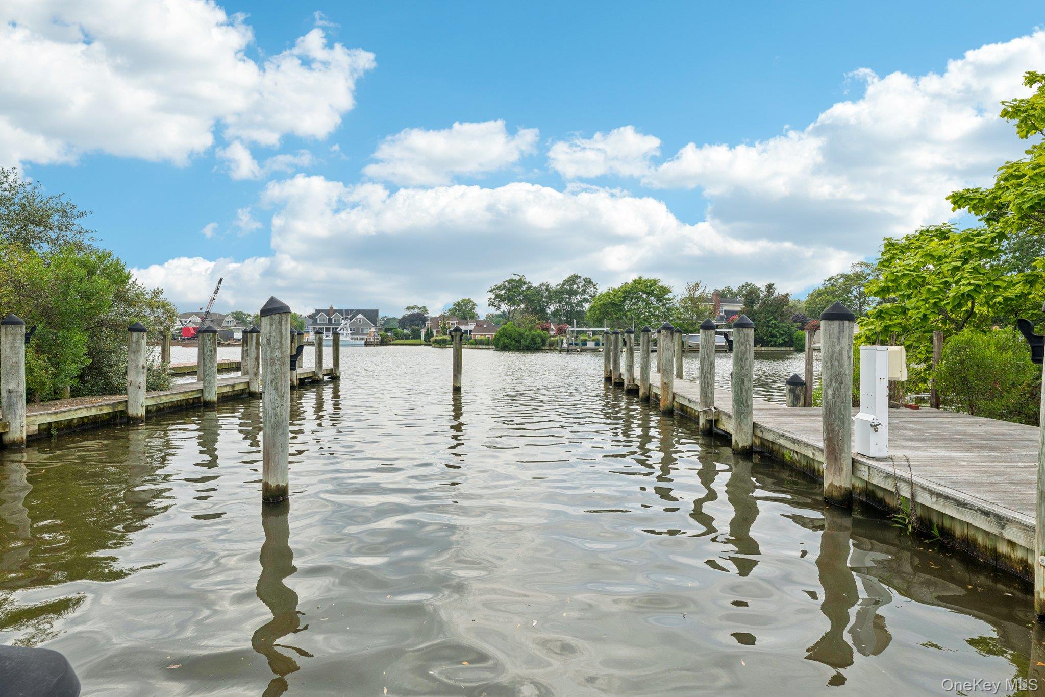 90 Thompson Avenue Babylon, NY 11702 - Photo 35 of 35 Dock featuring a water view