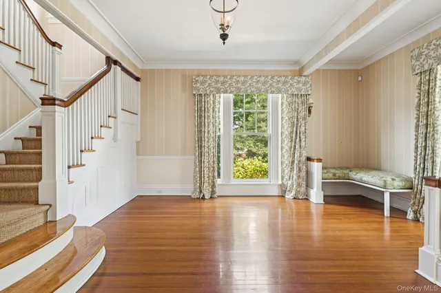 a view of livingroom with furniture wooden floor and windows