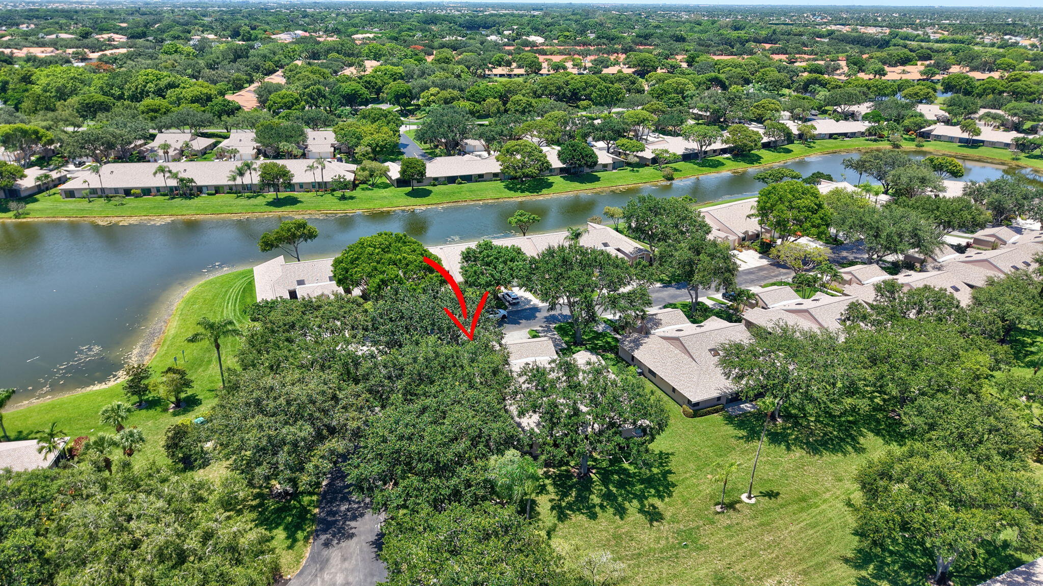 8306 Summersong Terrace Boca Raton, FL 33496 - Photo 48 of 51 an aerial view of city lake and trees all around
