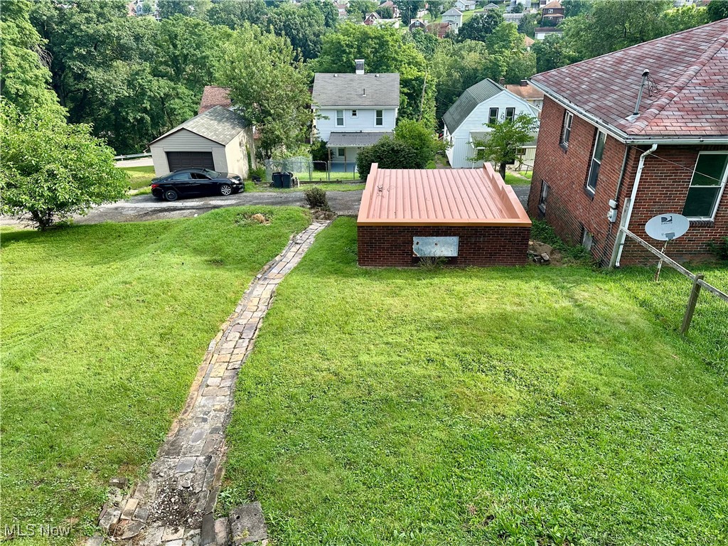 121 Pikeview Road Weirton, WV 26062 - Photo 37 of 41 View of Yard from Rear Porch featuring a garage