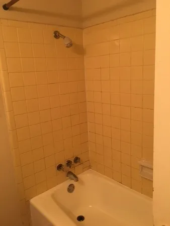 a bathroom with a sink and a shower