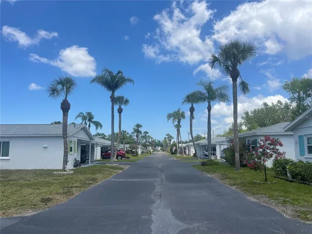 a view of a livingroom with a ceiling fan and window