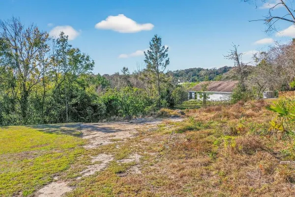 a view of a yard with an outdoor space and seating area