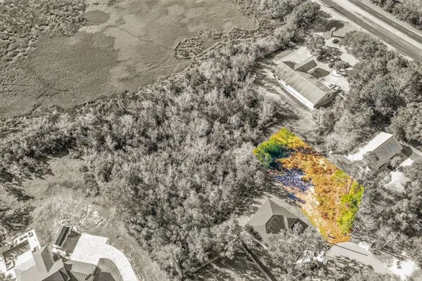 a aerial view of a house with a yard