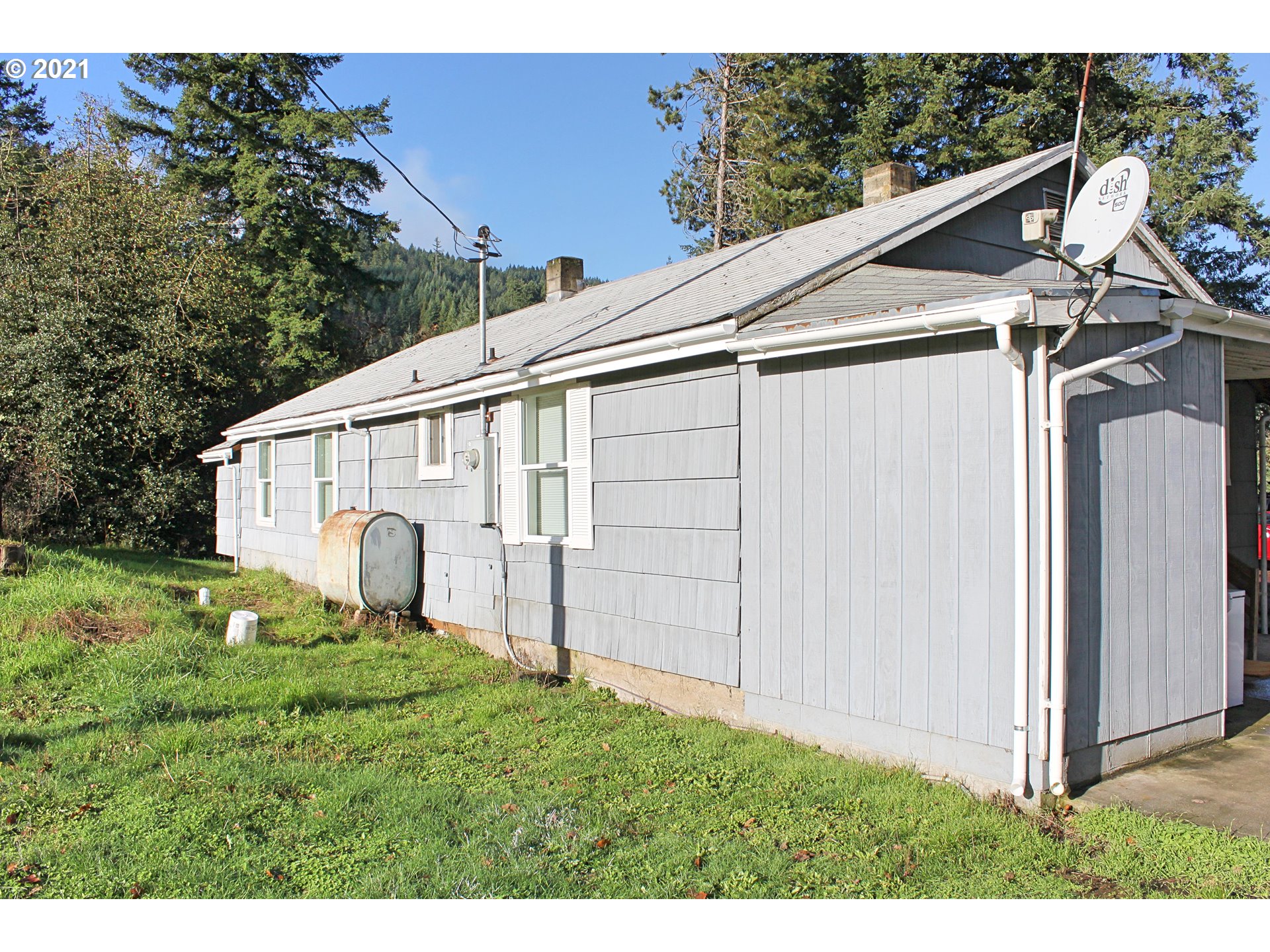 37877 Row River Road Dorena, OR 97434 - Photo 14 of 18 a view of a back yard of the house
