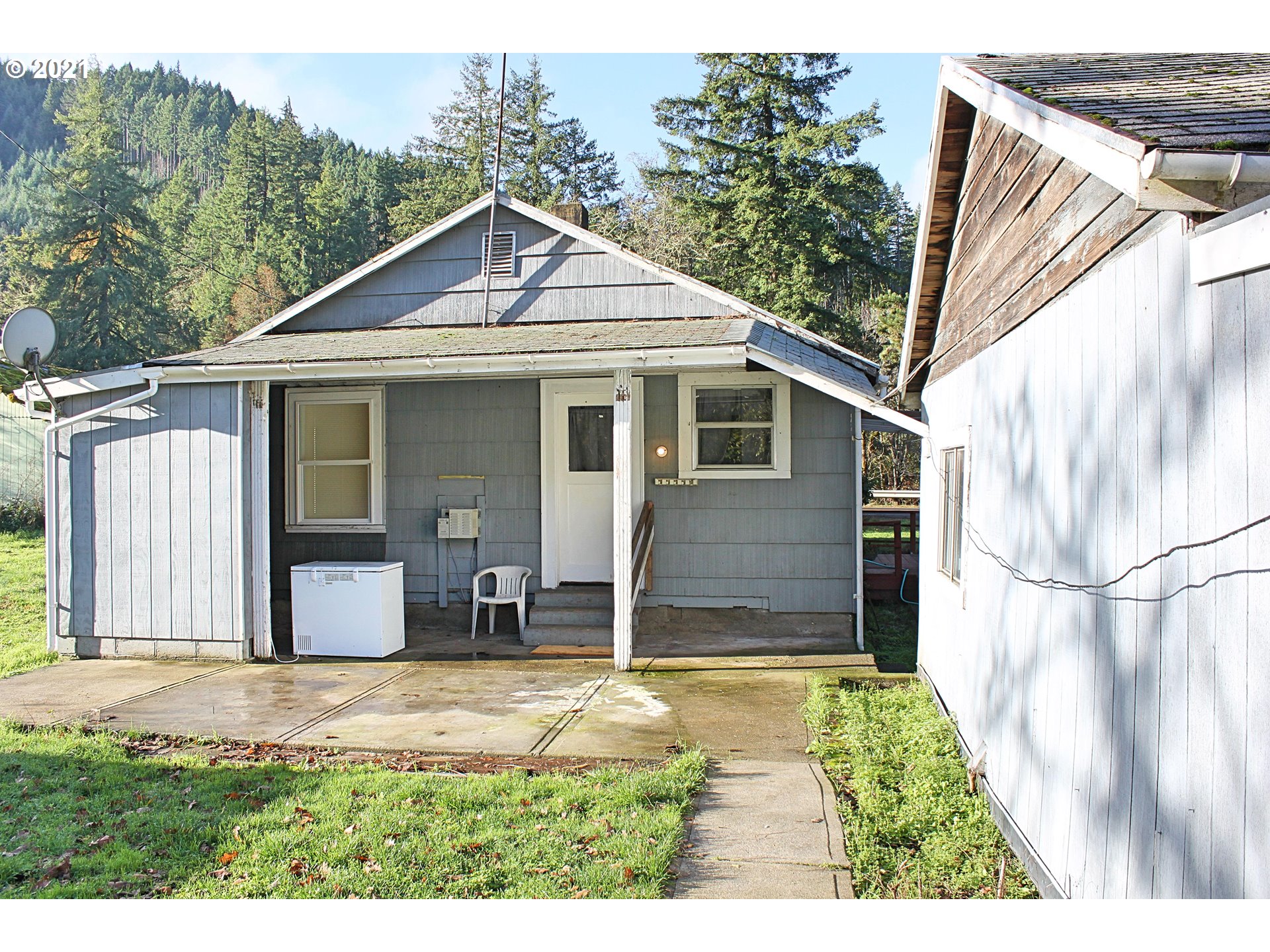 37877 Row River Road Dorena, OR 97434 - Photo 15 of 18 a view of house with backyard