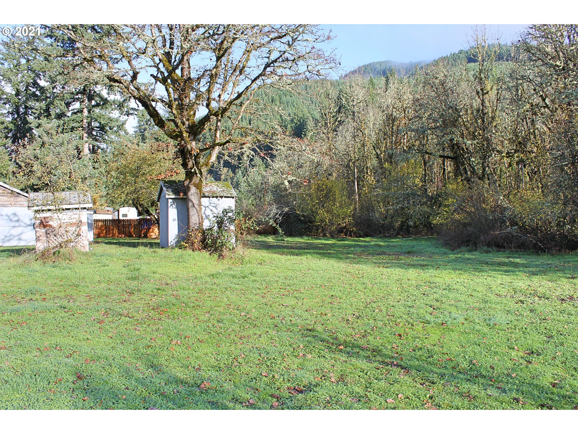 37877 Row River Road Dorena, OR 97434 - Photo 16 of 18 a view of a backyard with a garden