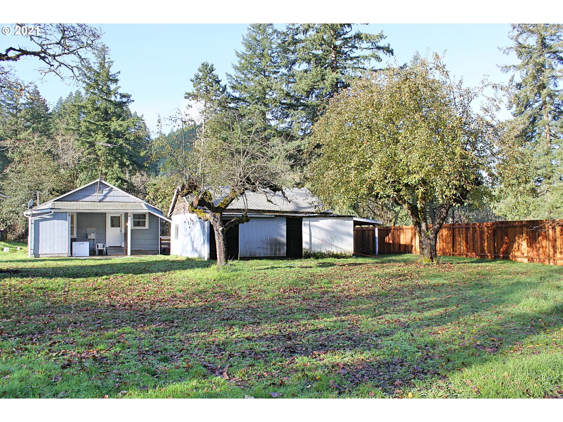 37877 Row River Road Dorena, OR 97434 - Photo 17 of 18 a house with a big yard and large trees