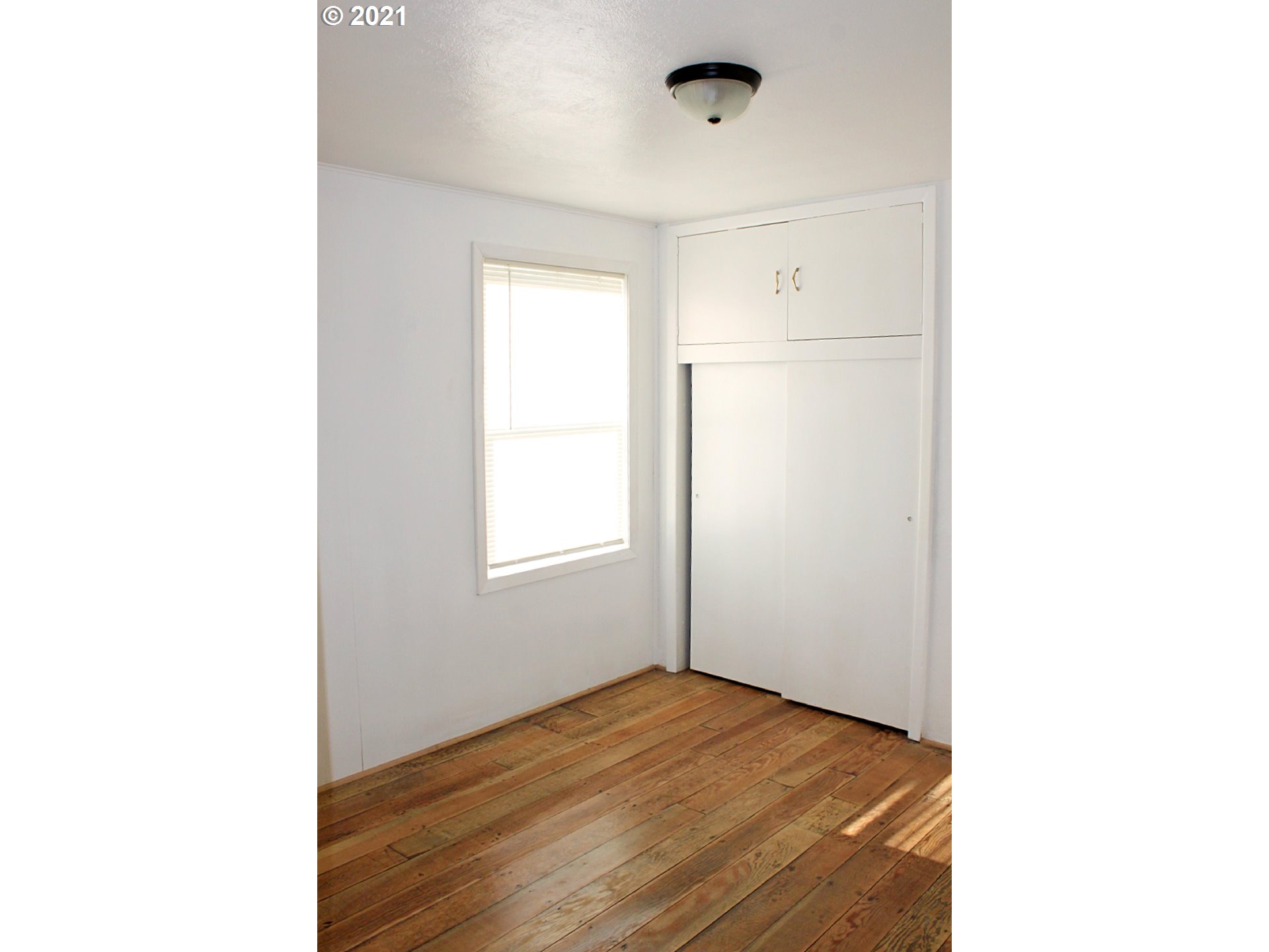 37877 Row River Road Dorena, OR 97434 - Photo 7 of 18 a view of empty room with wooden floor