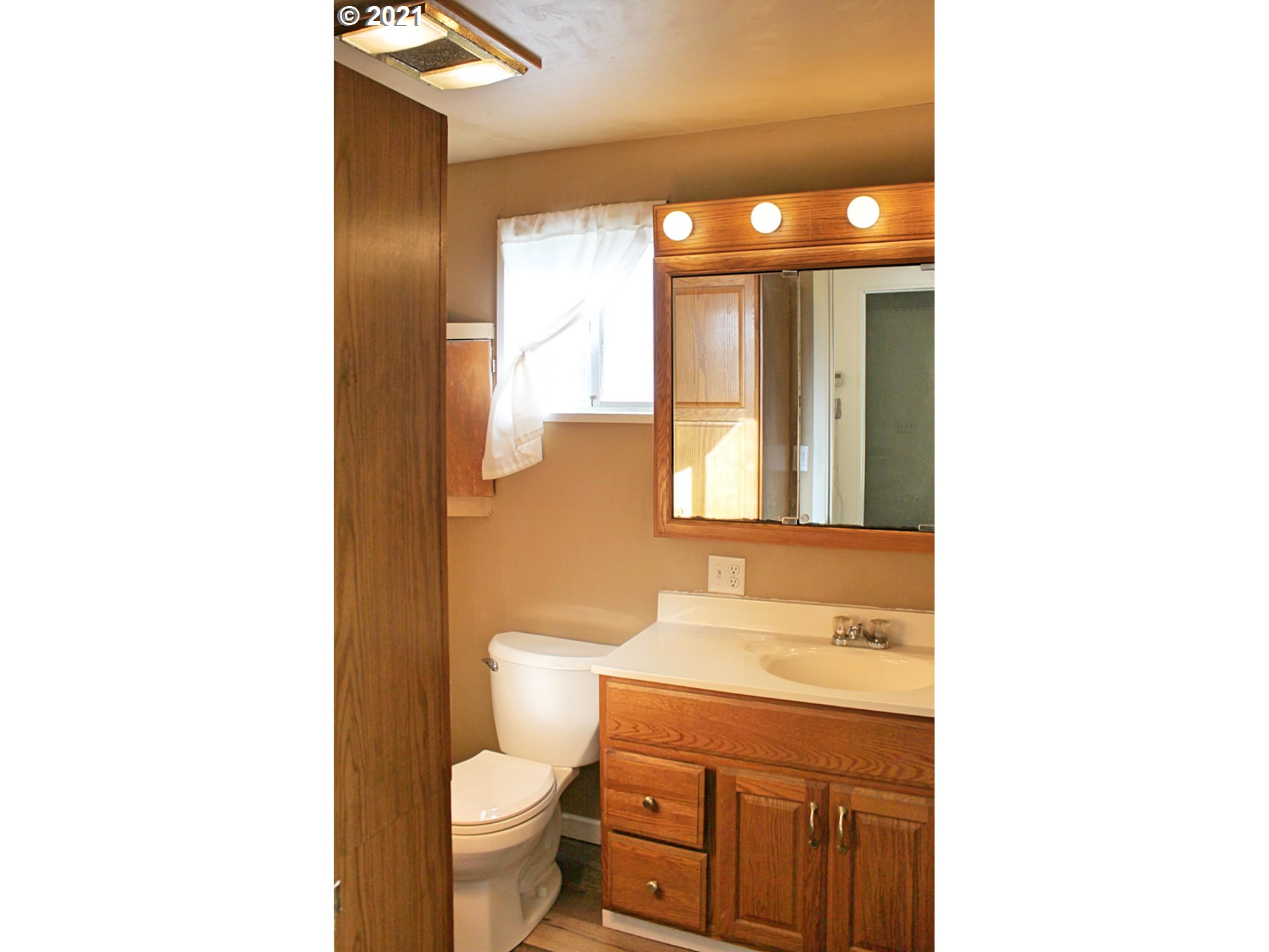 37877 Row River Road Dorena, OR 97434 - Photo 8 of 18 a bathroom with a sink a toilet a mirror and shower