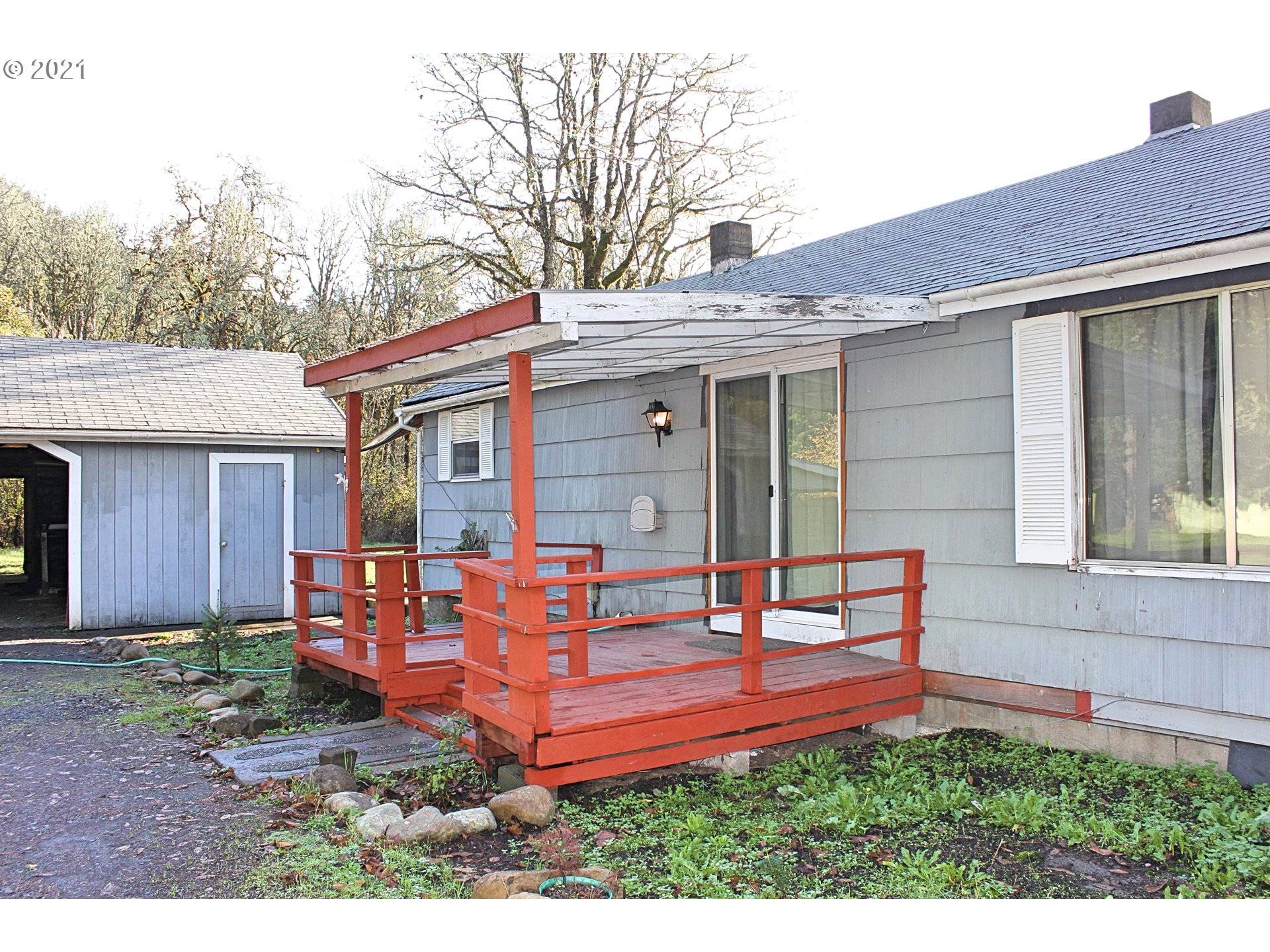 37877 Row River Road Dorena, OR 97434 - Photo 10 of 18 a front view of a house with garden