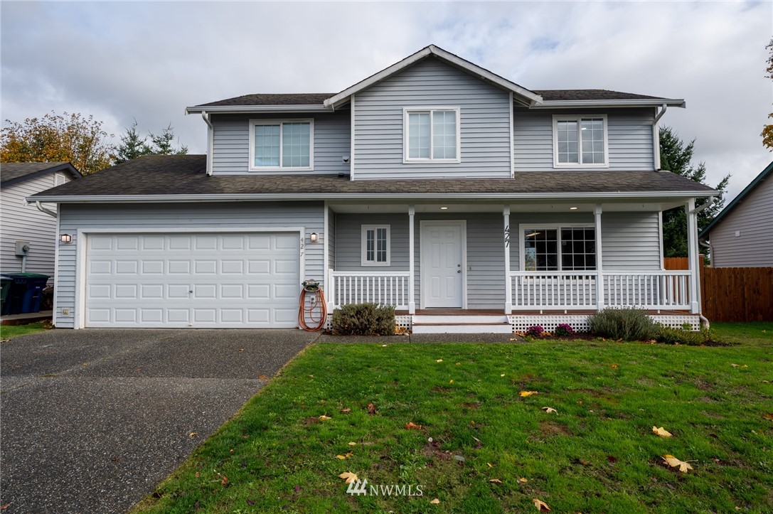 427 Rohrer Loop Sedro-Woolley, WA 98284 - Photo 1 of 36 a front view of a house with a yard and garage