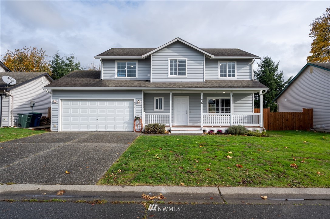 427 Rohrer Loop Sedro-Woolley, WA 98284 - Photo 2 of 36 a front view of a house with a yard and garage