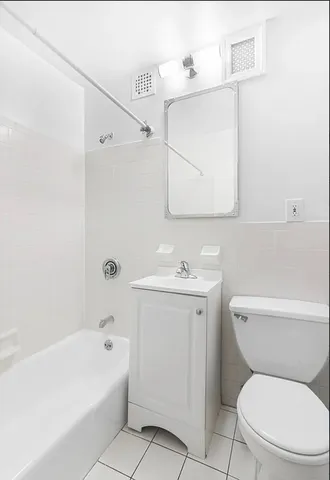 a bathroom with a sink a toilet and a bathtub