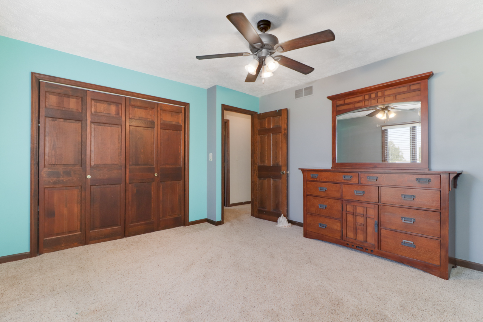 1607 Gregory Street Normal, IL 61761 - Photo 18 of 32 a bedroom with a large bed and a large closet