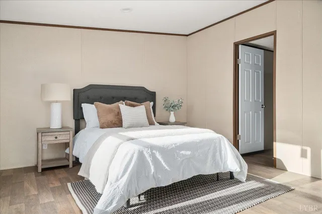 a bedroom with a bed and a night stand