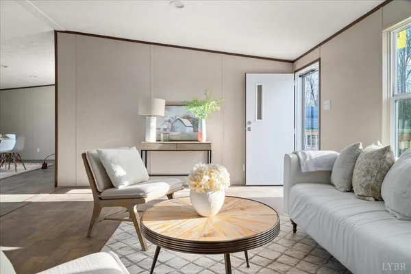 a living room with furniture and a table