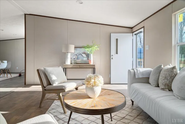 a living room with furniture and a table