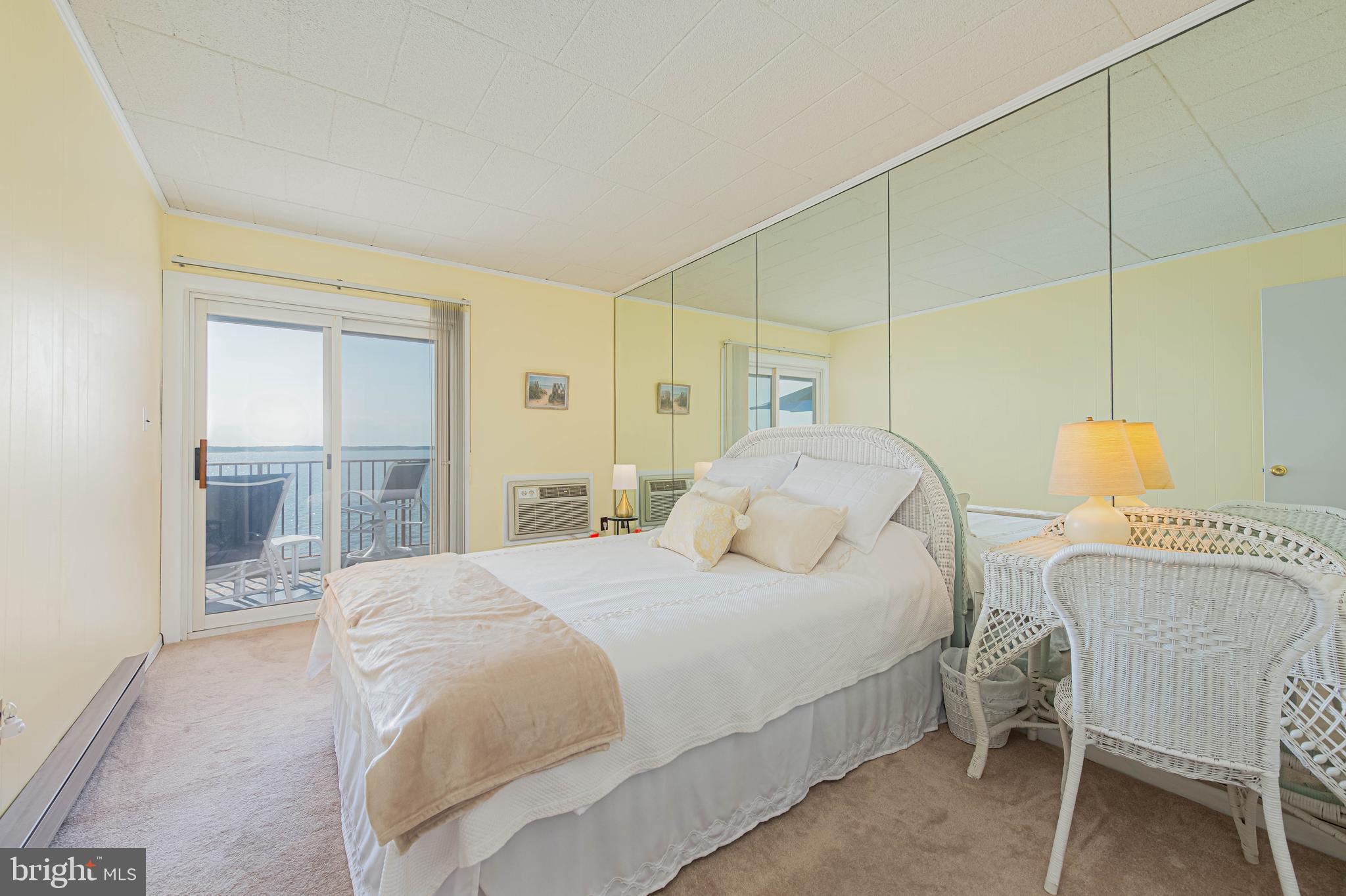 745 Mooring Road, Unit 406 Ocean City, MD 21842 - Photo 13 of 24 a bedroom with a bed and a window