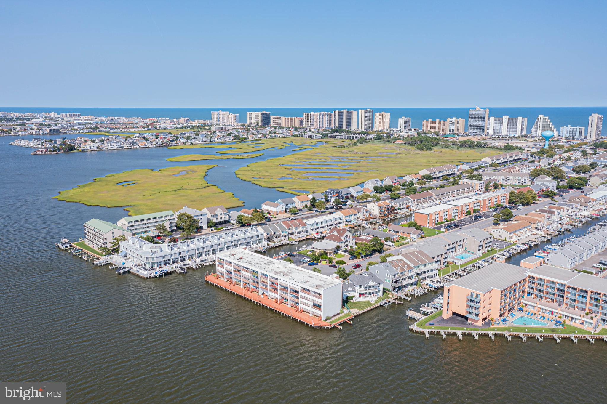 745 Mooring Road, Unit 406 Ocean City, MD 21842 - Photo 20 of 24 a view of a swimming pool with an ocean view