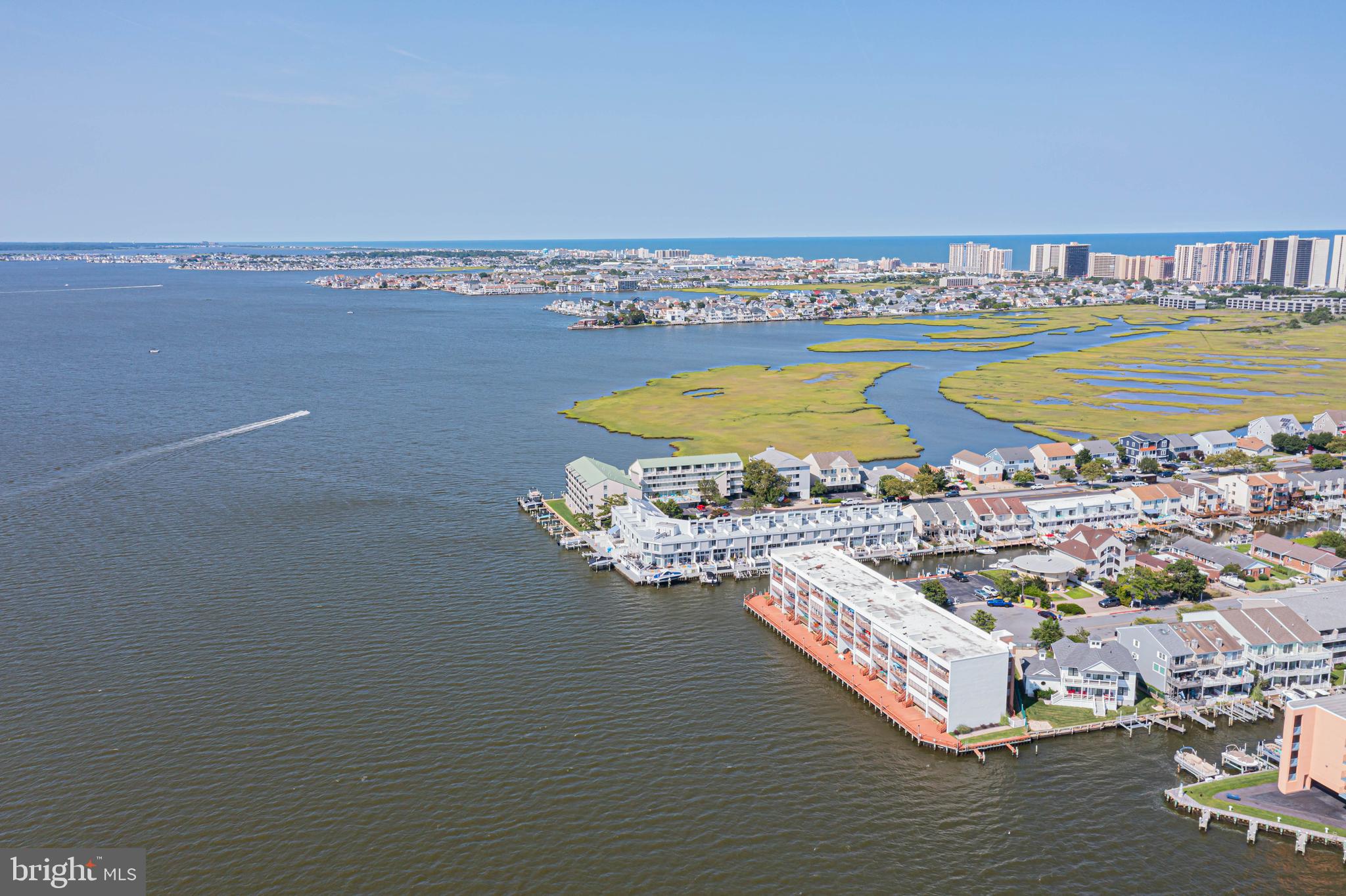 745 Mooring Road, Unit 406 Ocean City, MD 21842 - Photo 21 of 24 a view of a water with an ocean beach