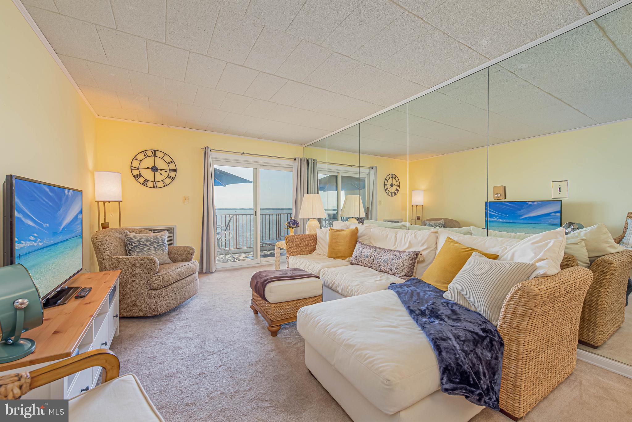 745 Mooring Road, Unit 406 Ocean City, MD 21842 - Photo 5 of 24 a living room with furniture and a table