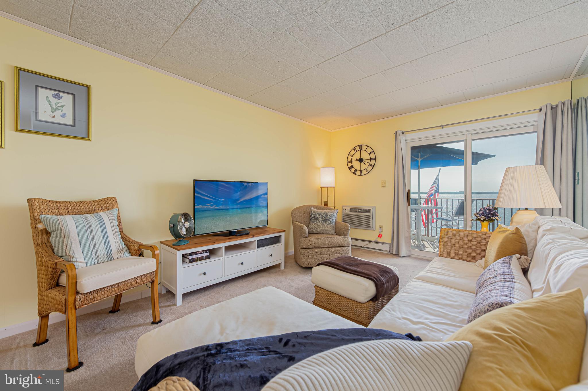 745 Mooring Road, Unit 406 Ocean City, MD 21842 - Photo 8 of 24 a living room with furniture and a couch