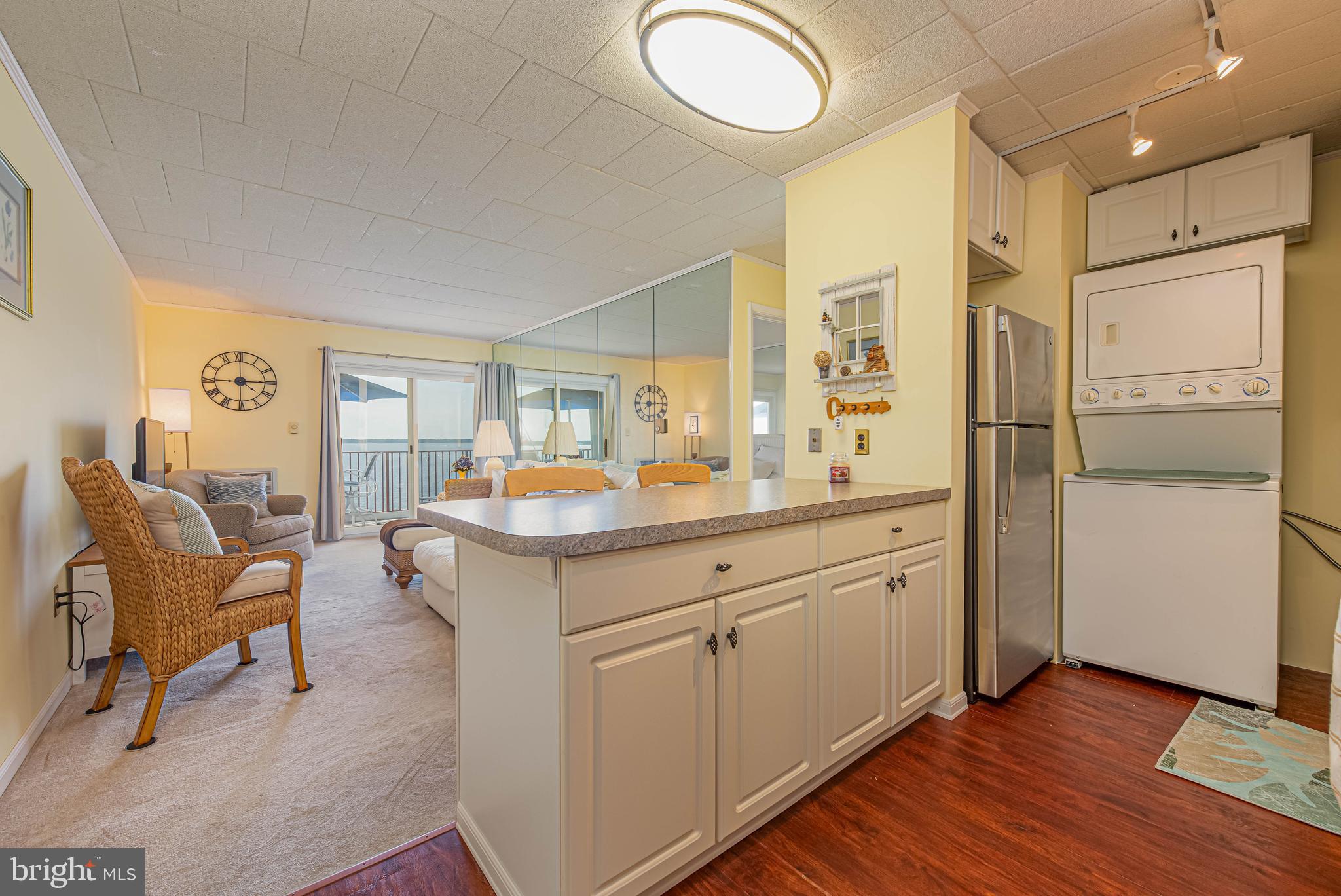 745 Mooring Road, Unit 406 Ocean City, MD 21842 - Photo 10 of 24 a spacious bathroom with a double vanity sink and a mirror