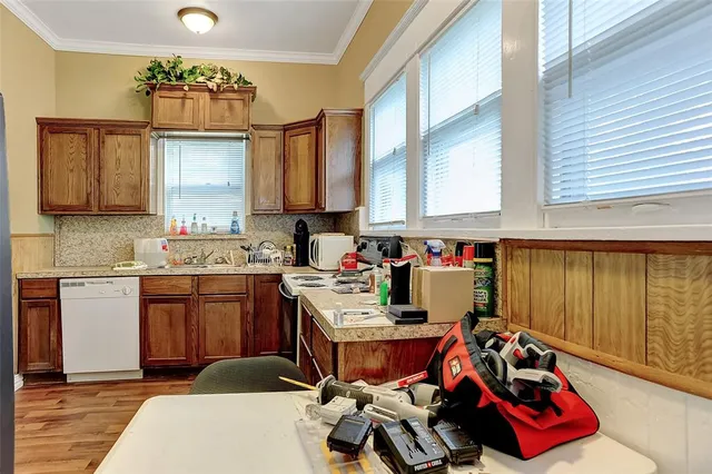 a room with furniture a window and dresser