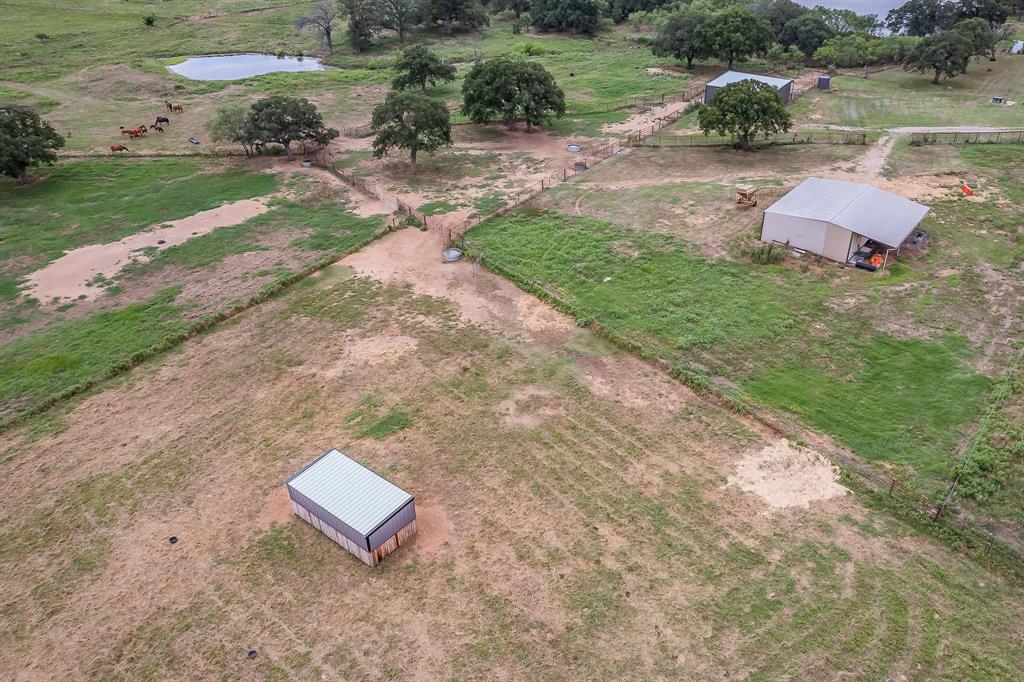 495 Lyles Road Henrietta, TX 76365 - Photo 11 of 18 Bird's eye view with a water view and a rural view