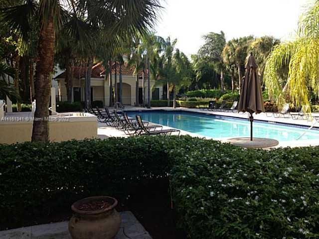 610 South Park Road, Unit 111 Hollywood, FL 33021 - Photo 2 of 7 a view of a yard with plants and trees