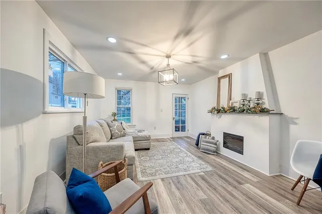 a very nice looking room with a large window and a table