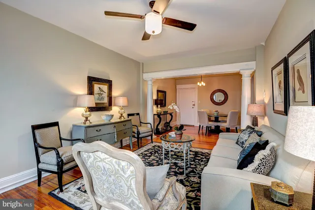 a kitchen with stainless steel appliances granite countertop a white cabinets and wooden floor