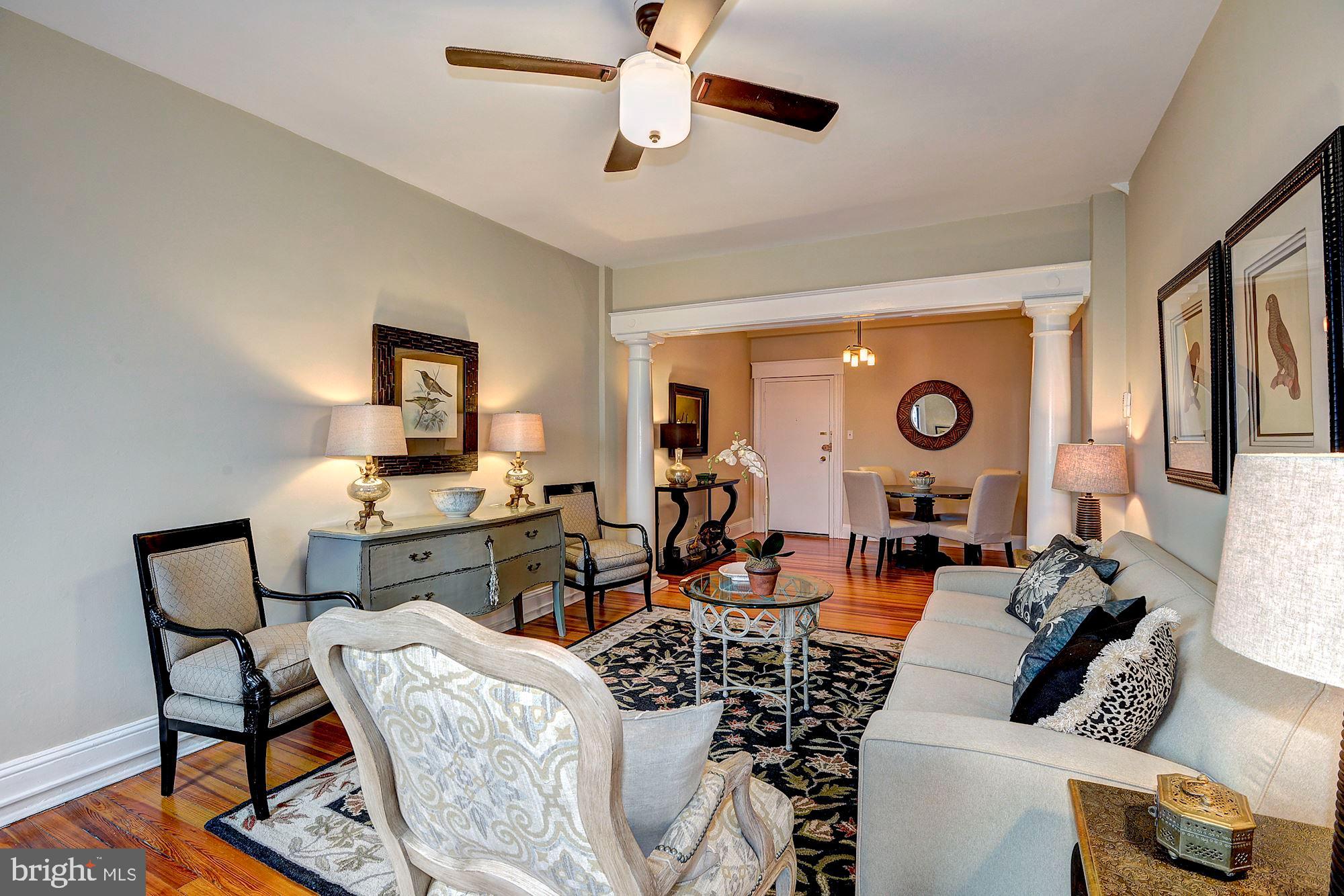 2022 Columbia Road Northwest, Unit 612 Washington, DC 20009 - Photo 11 of 29 a living room with furniture and a flat screen tv