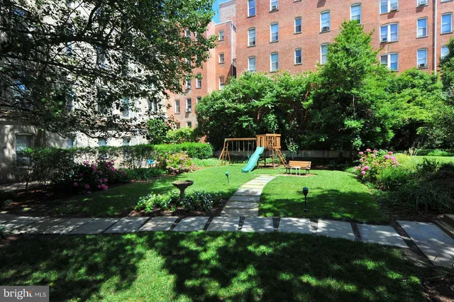 a view of a garden with a house