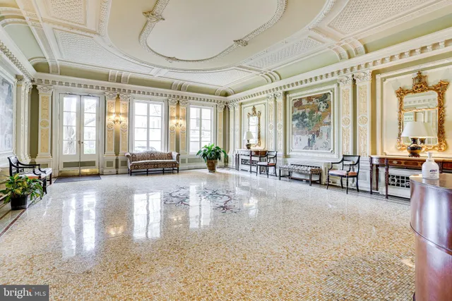 a lobby with furniture and floor to ceiling window