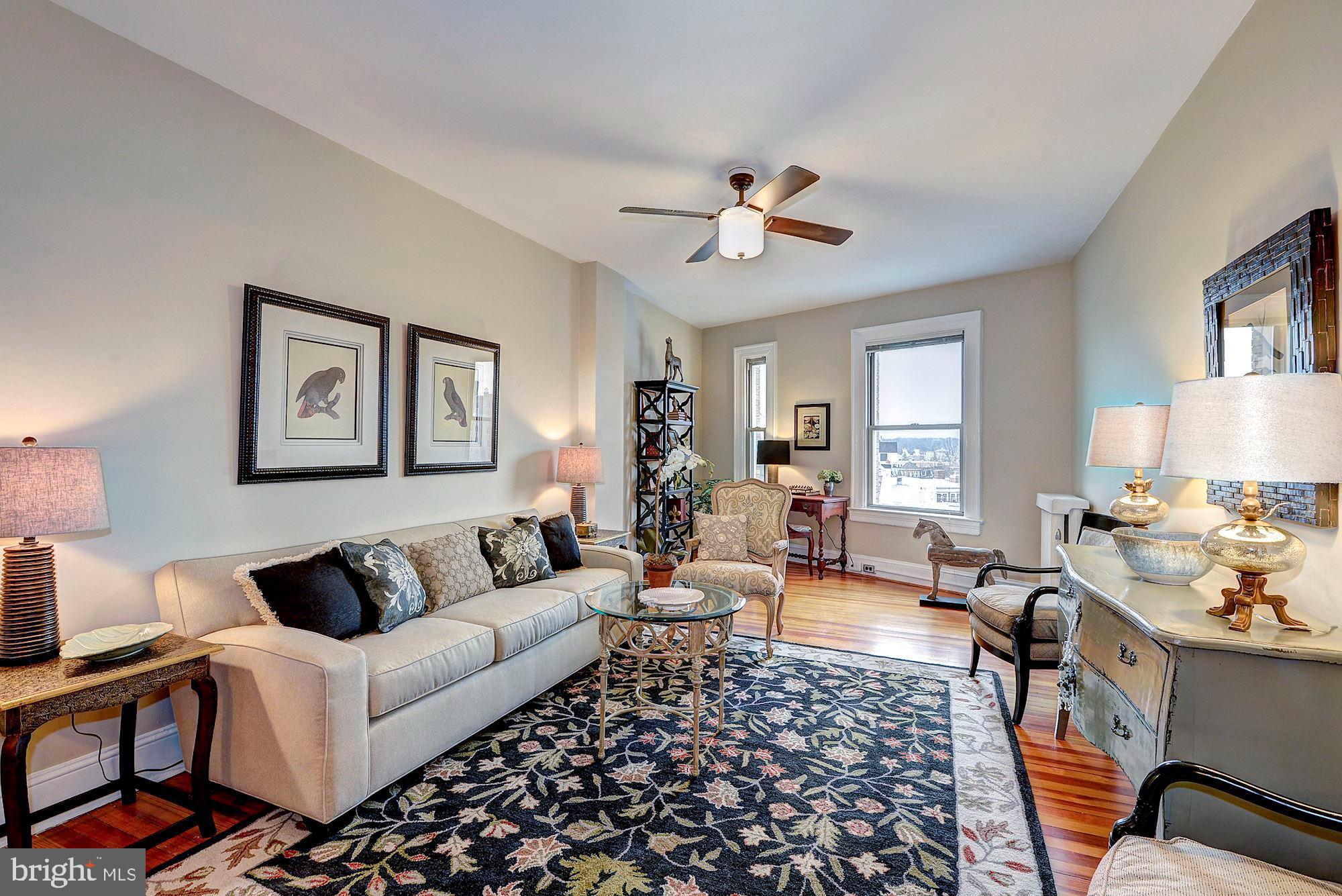 2022 Columbia Road Northwest, Unit 612 Washington, DC 20009 - Photo 8 of 29 a living room with furniture or couch and a window
