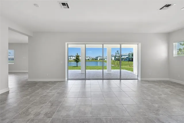 a view of an entryway with floor to ceiling window