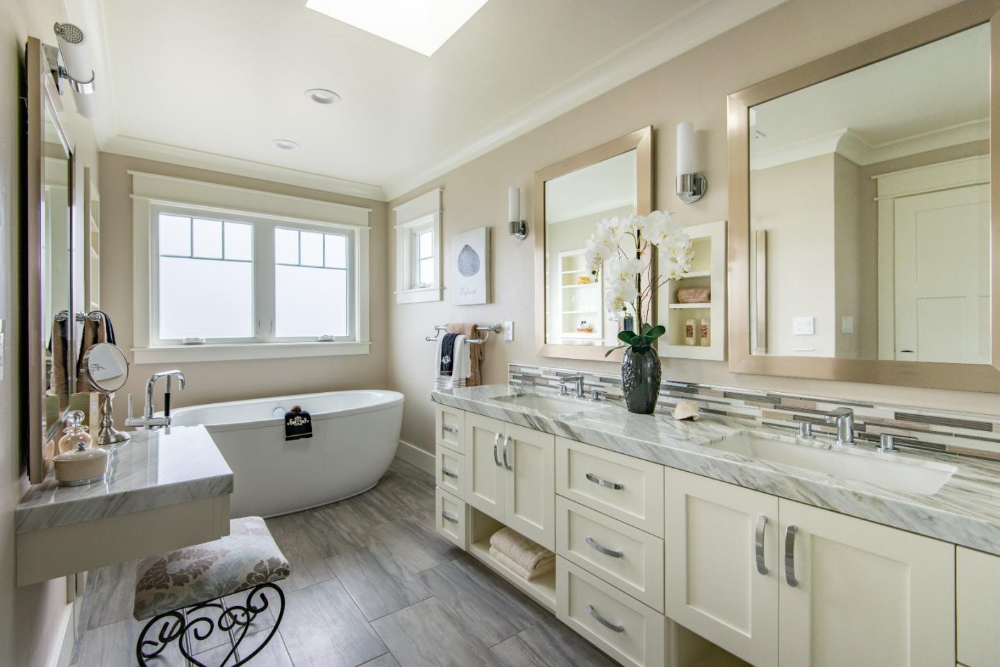 10416 Prune Tree Lane Cupertino, CA 95014 - Photo 11 of 21 a spacious bathroom with sinks mirror and a bathtub
