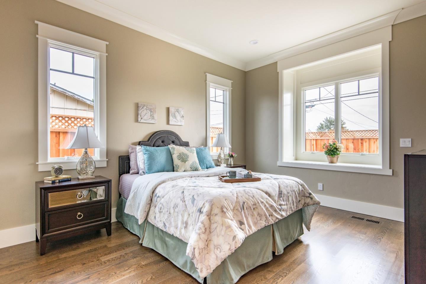 10416 Prune Tree Lane Cupertino, CA 95014 - Photo 15 of 21 a bedroom with a bed and a window