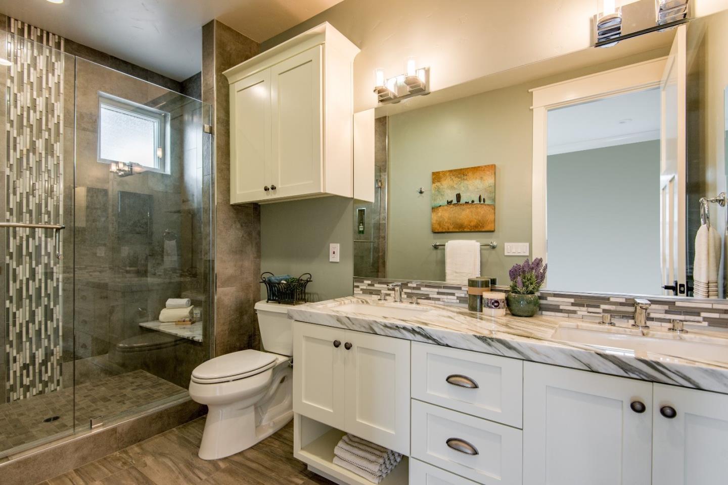 10416 Prune Tree Lane Cupertino, CA 95014 - Photo 16 of 21 a bathroom with a granite countertop sink toilet and shower
