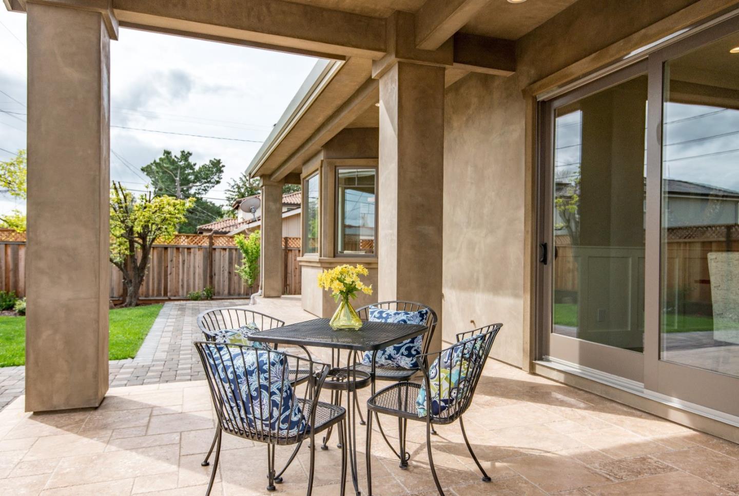10416 Prune Tree Lane Cupertino, CA 95014 - Photo 19 of 21 a view of an outdoor dining space with a table and chairs